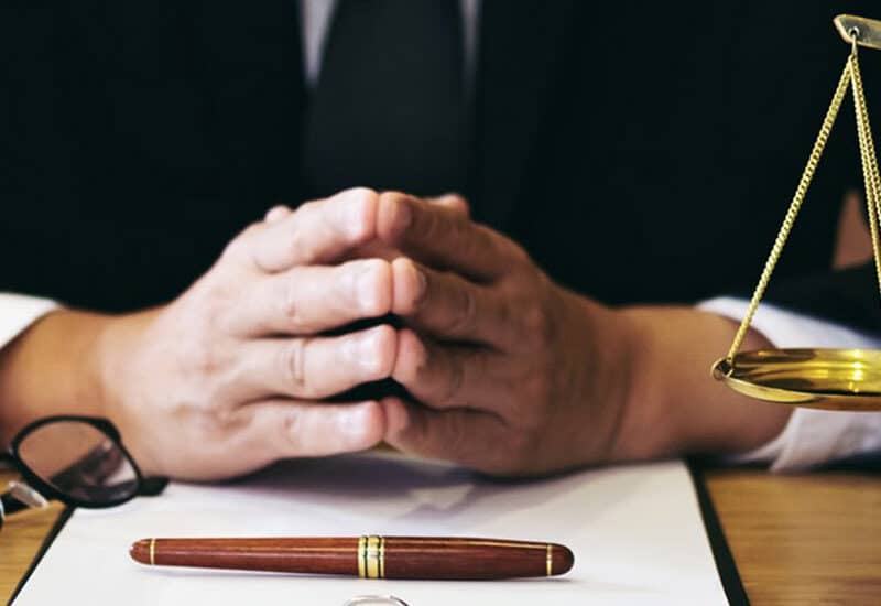 lawyer sitting at desk explaining the difference between civil and criminal case