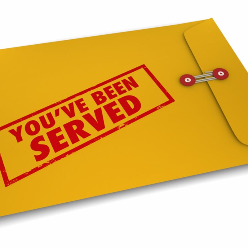 yellow envelope with you've been served in red typography.