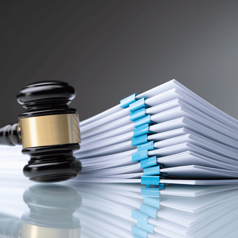photo of a gavel and some legal files