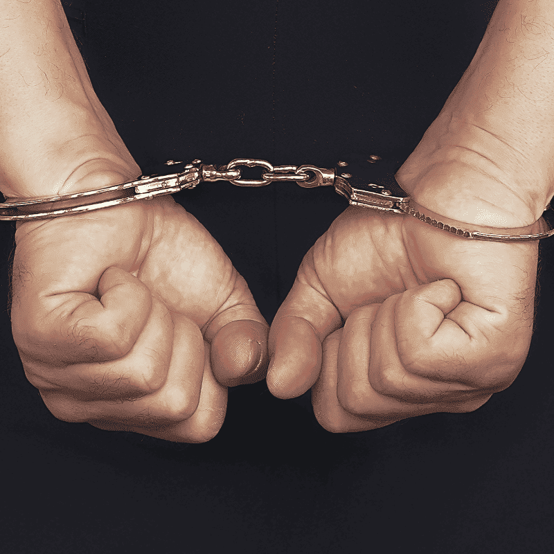 photo of a handcuffed man