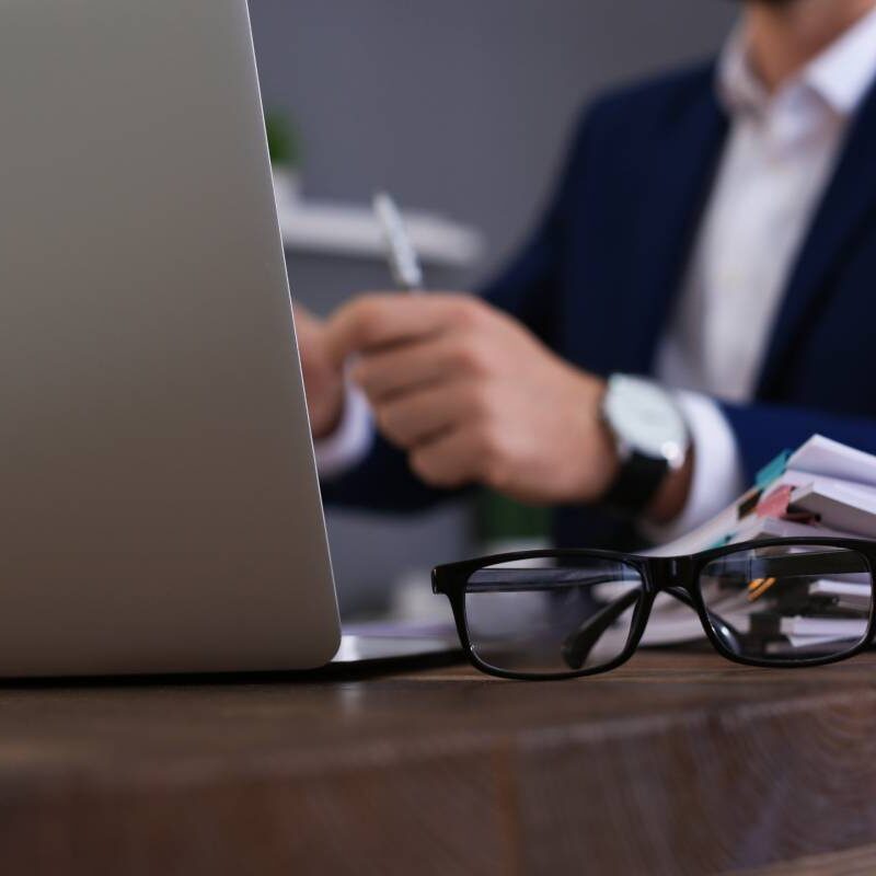 photo of lawyer behind a pc