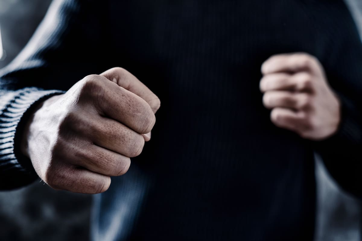 Two clenched fists representing a common assault confrontation